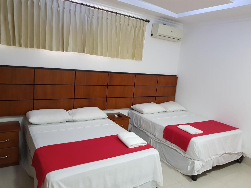 Postel nebo postele na pokoji v ubytování Hotel Apart Guayaquil Aeropuerto