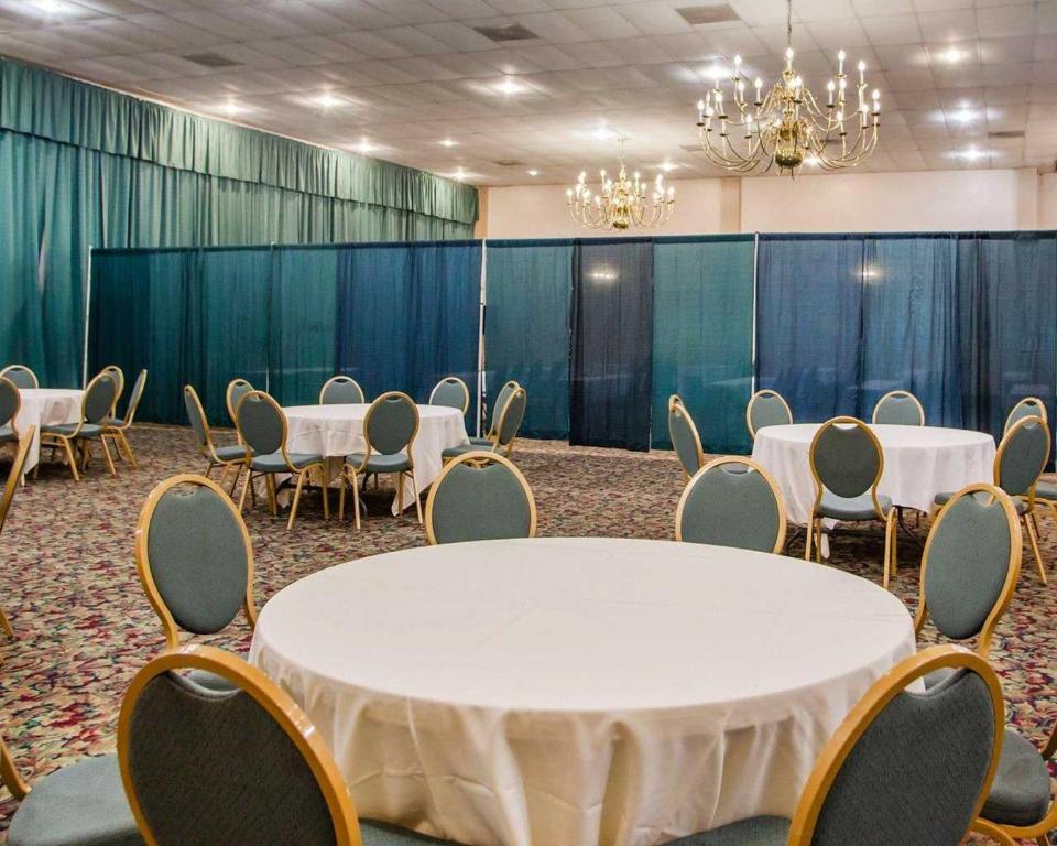 a conference room with a white table and chairs at Parkview Inn and Conference Center in Allentown