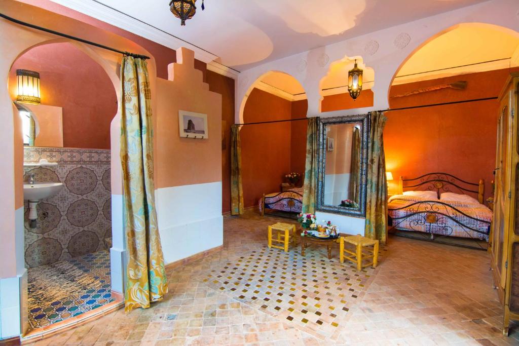 Postel nebo postele na pokoji v ubytování Le Relais De Marrakech