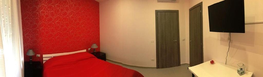 Tempat tidur dalam kamar di La Cabala b&b
