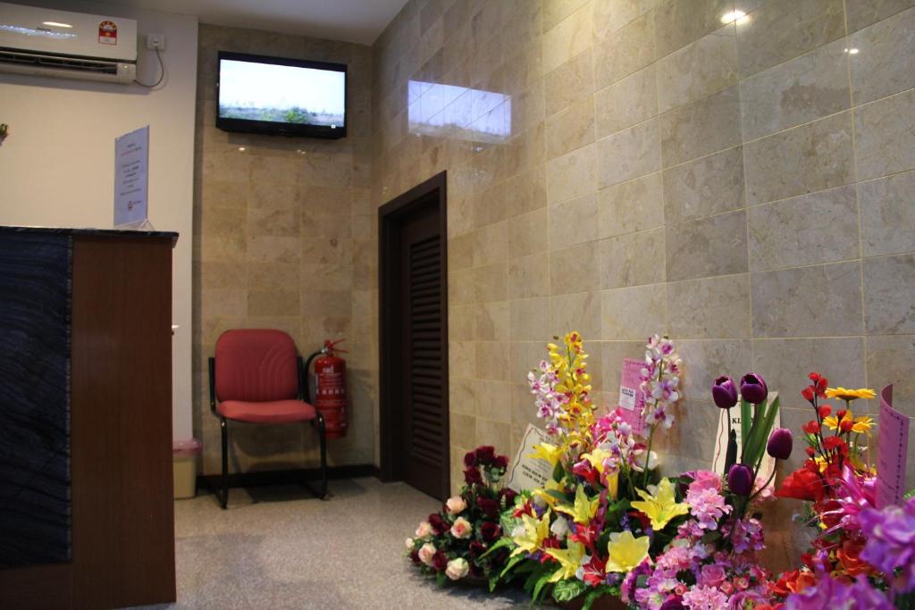 TV a/nebo společenská místnost v ubytování KL Hotel