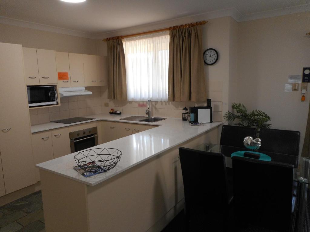 Kuchyň nebo kuchyňský kout v ubytování Beaches Serviced Apartments