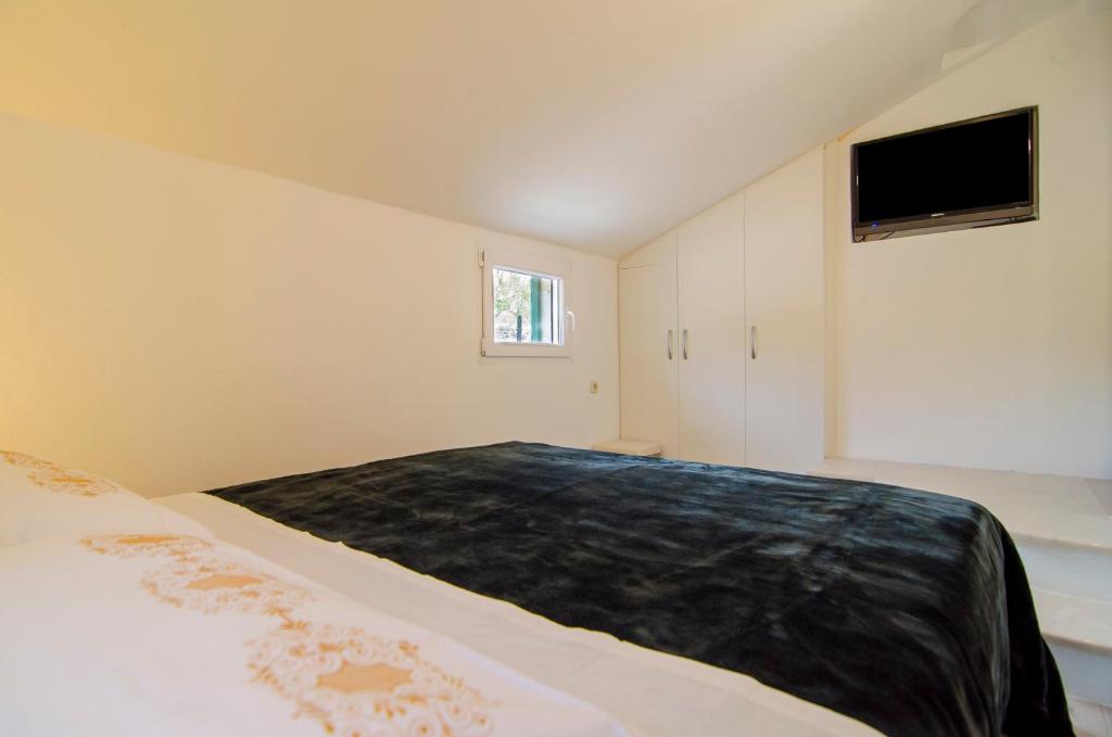 Postel nebo postele na pokoji v ubytování Holiday Home Bliss
