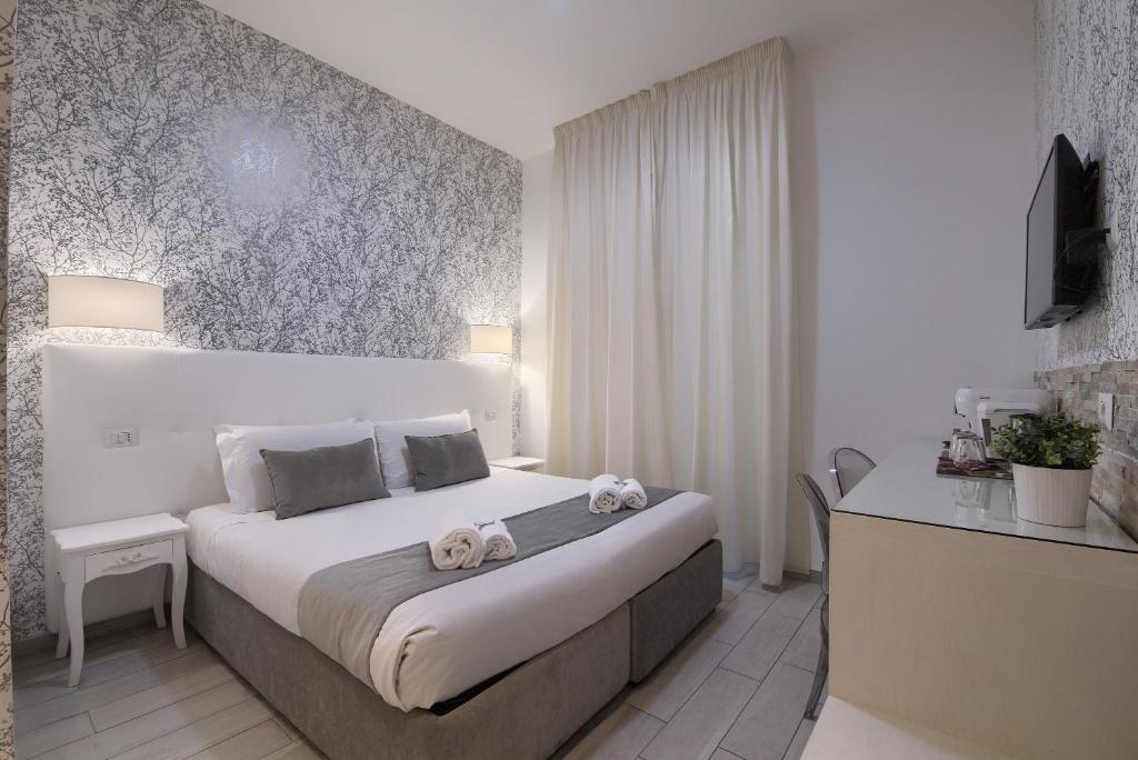 Postel nebo postele na pokoji v ubytování Vatican Tourist Inn