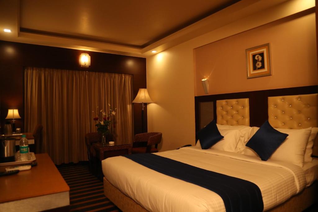 Postelja oz. postelje v sobi nastanitve Hotel Dr Rajkumar International