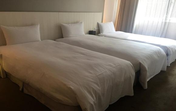 Voodi või voodid majutusasutuse Forward Hotel Taipei Nangang toas