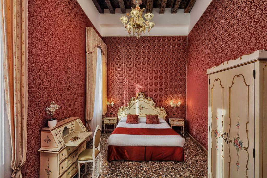 Postel nebo postele na pokoji v ubytování Hotel Tre Archi