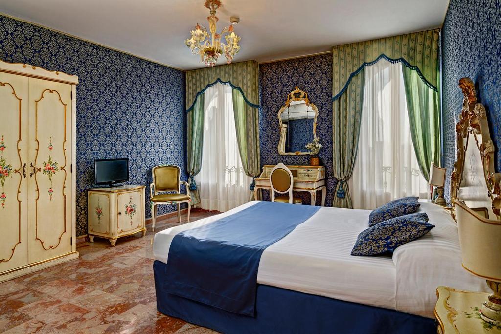 Postel nebo postele na pokoji v ubytování Hotel Tre Archi