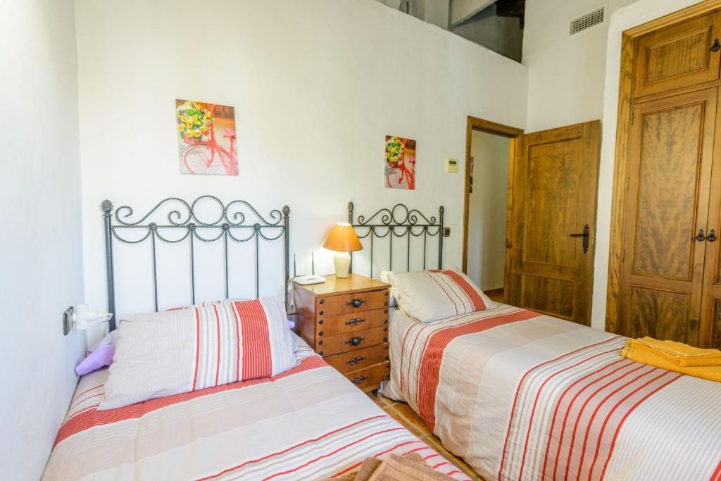 Posteľ alebo postele v izbe v ubytovaní Cubo's Casa La Viña