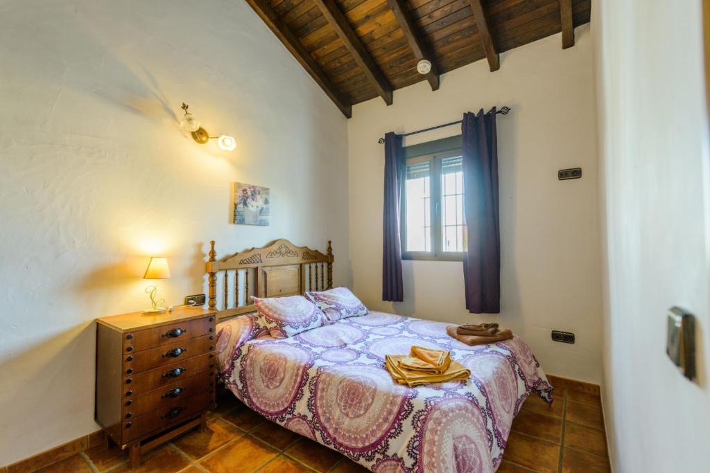 Posteľ alebo postele v izbe v ubytovaní Cubo's Casa La Viña
