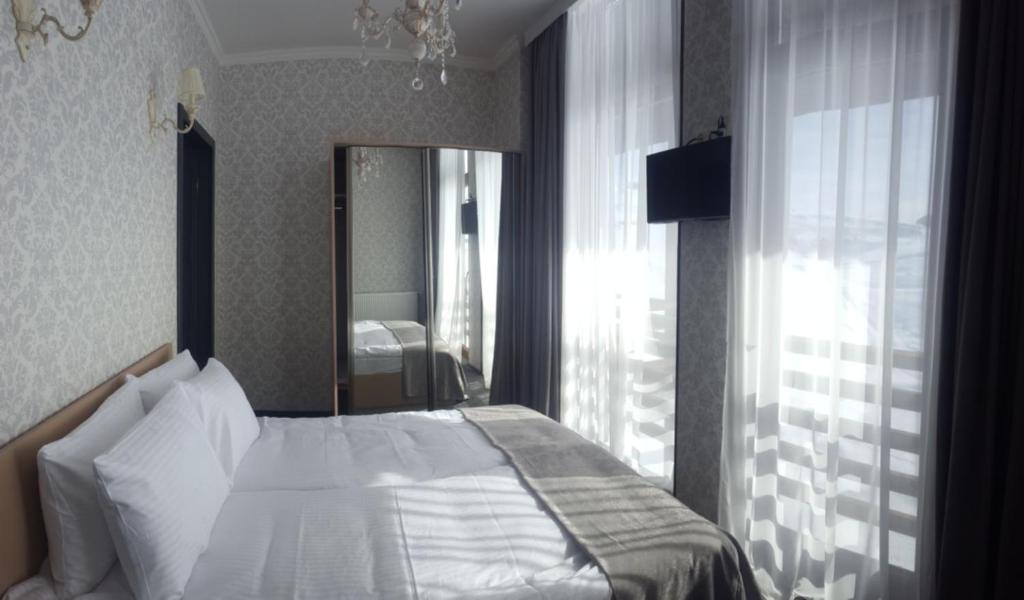 Ένα ή περισσότερα κρεβάτια σε δωμάτιο στο Hotel Winerooms