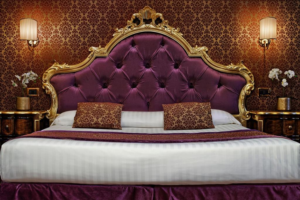 Postel nebo postele na pokoji v ubytování Hotel Tre Archi