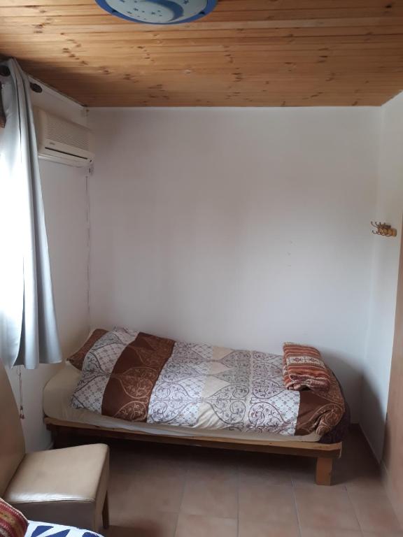 Postel nebo postele na pokoji v ubytování Sapir Apartment