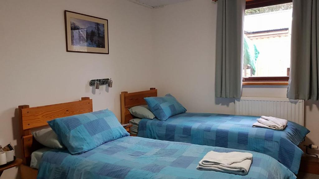 Postel nebo postele na pokoji v ubytování Insh Hall