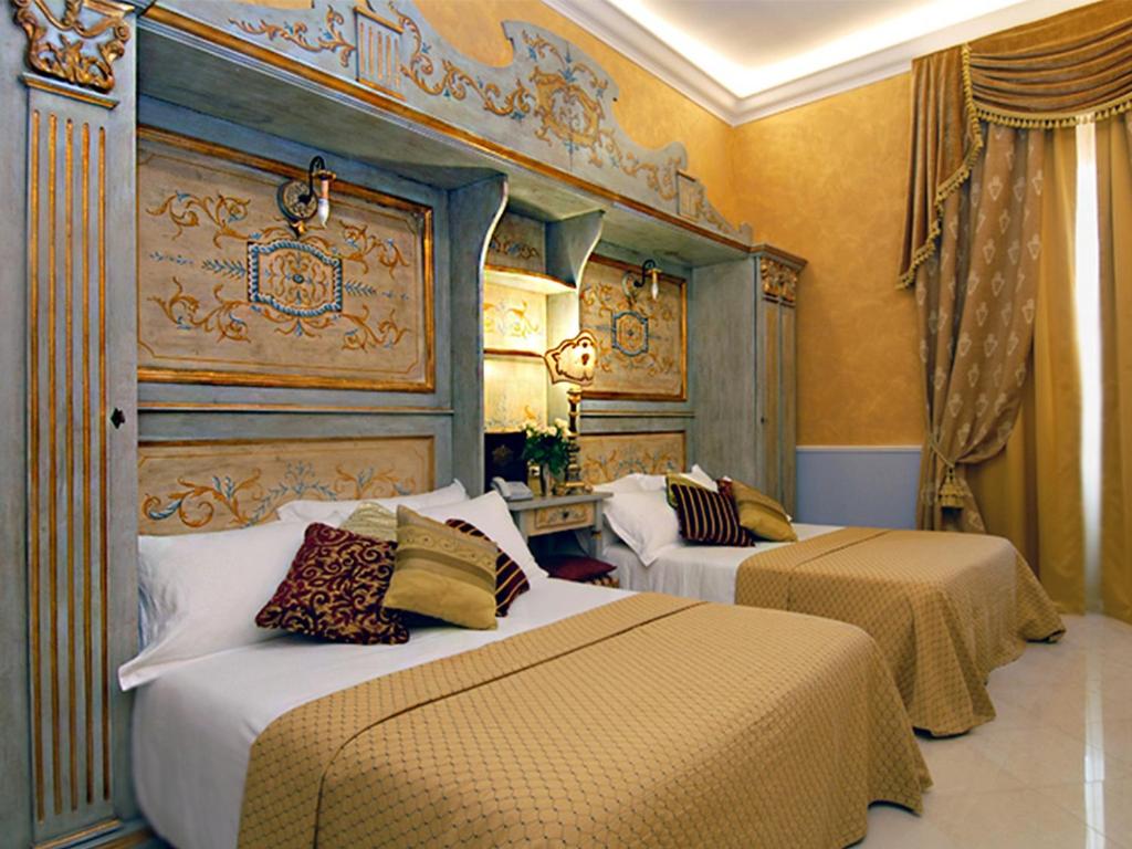 Postel nebo postele na pokoji v ubytování Romanico Palace Luxury Hotel & SPA