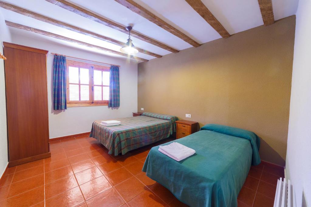 Postel nebo postele na pokoji v ubytování Apartamentos Ribera del Júcar