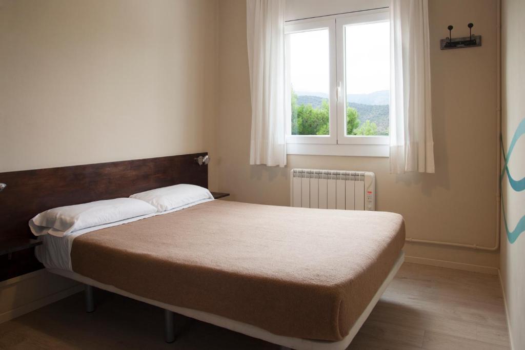 Posteľ alebo postele v izbe v ubytovaní Alberg Costa Brava