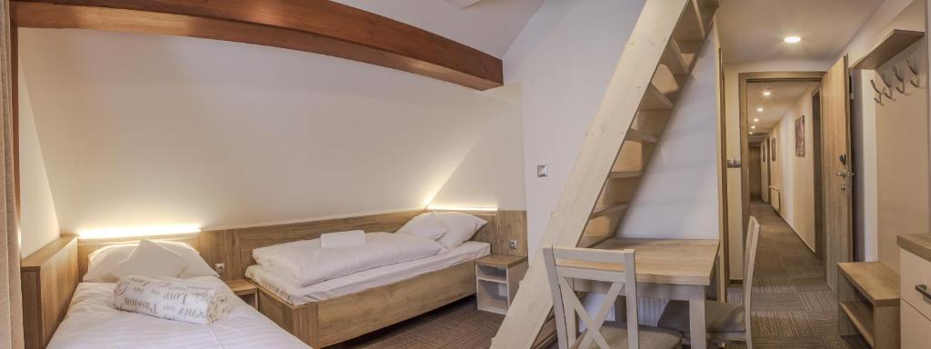 Postel nebo postele na pokoji v ubytování Penzion Šléglov