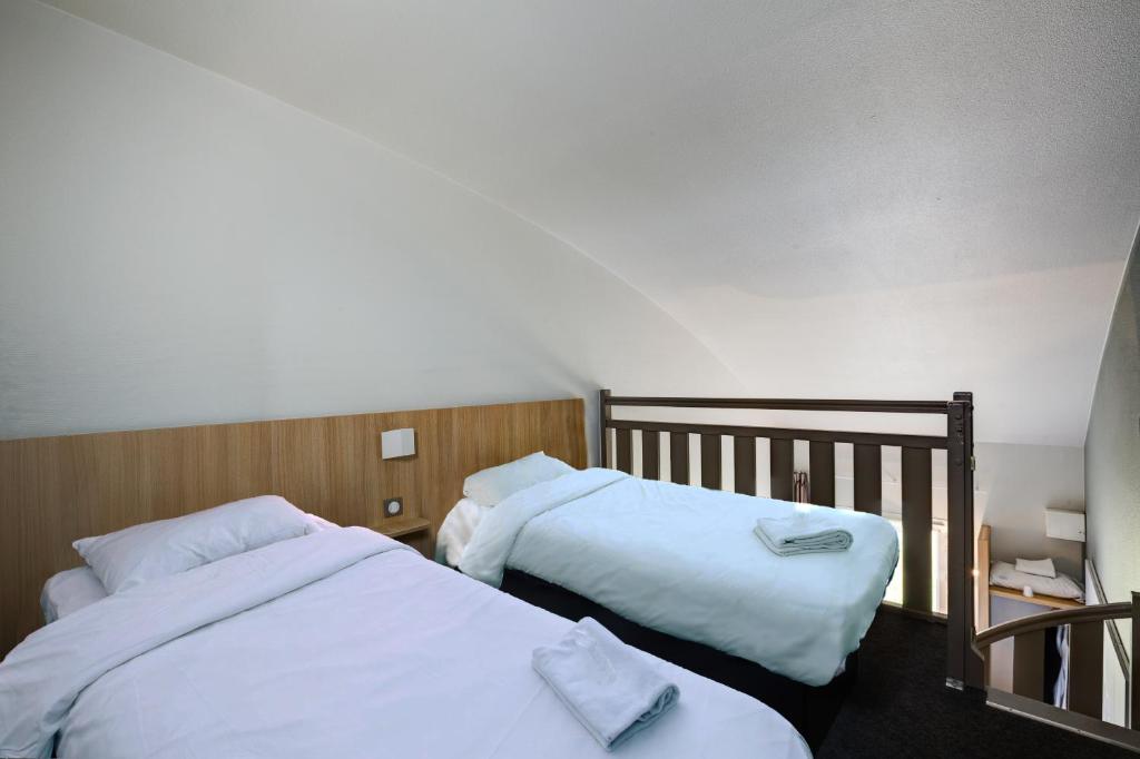 Postel nebo postele na pokoji v ubytování B&B HOTEL Beauvais