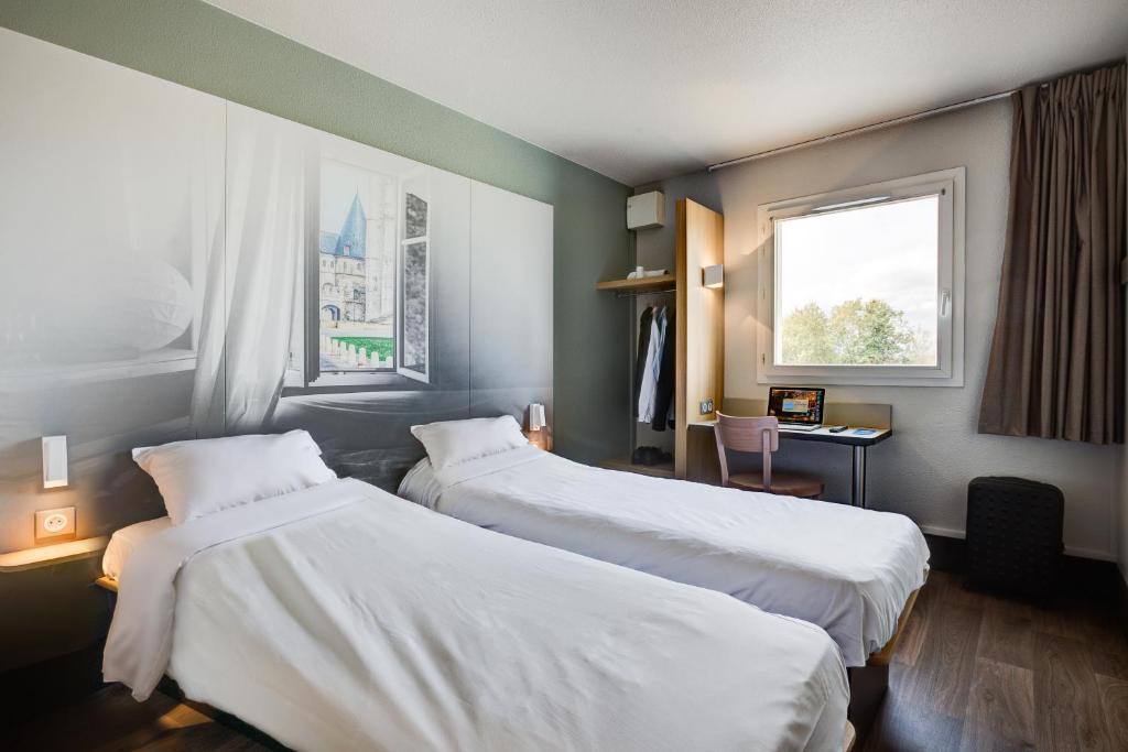 Postel nebo postele na pokoji v ubytování B&B HOTEL Beauvais