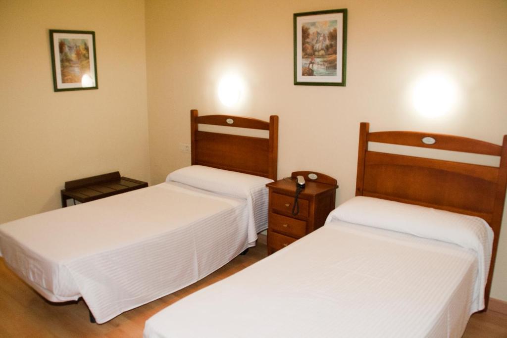 Postel nebo postele na pokoji v ubytování Hotel Anfora