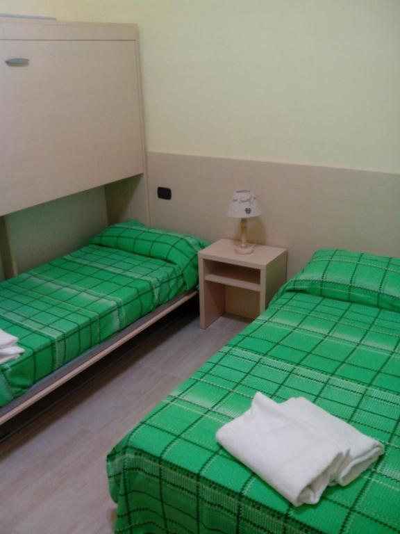 Cama o camas de una habitación en Guest House Hola Roma