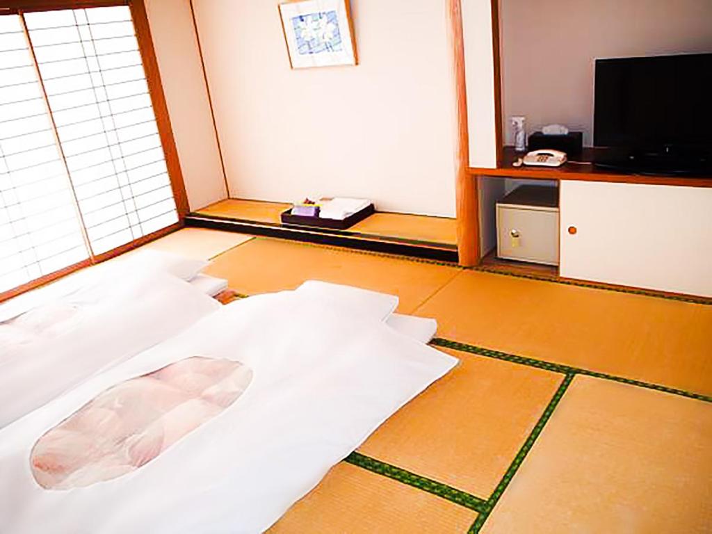 Postel nebo postele na pokoji v ubytování Blancvert Nasu Onsen Hotel