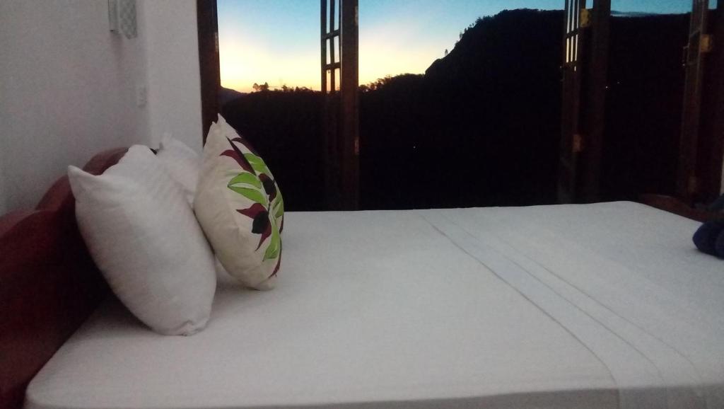 Postel nebo postele na pokoji v ubytování Daban Homestay Ella