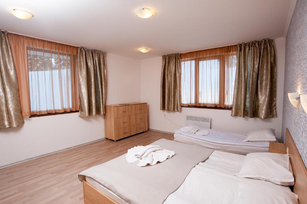 Postel nebo postele na pokoji v ubytování Forest Nook Aparthotel
