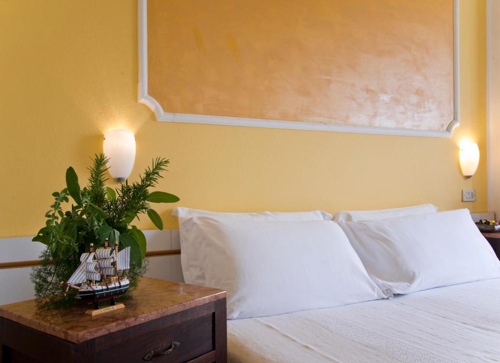 Postel nebo postele na pokoji v ubytování Hotel Trafalgar