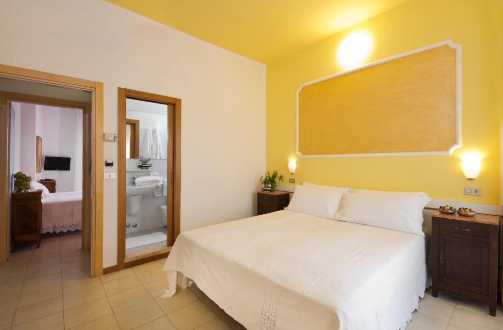 Postel nebo postele na pokoji v ubytování Hotel Trafalgar