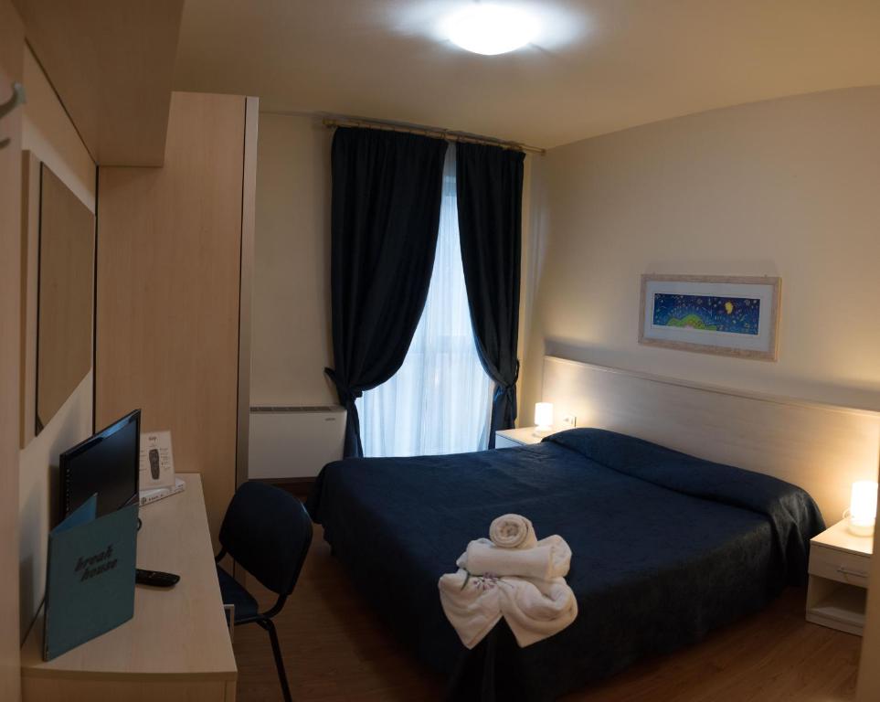 Postel nebo postele na pokoji v ubytování Hotel Break House Ristorante
