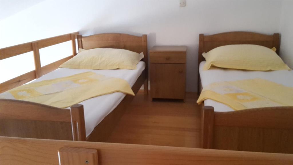 Postel nebo postele na pokoji v ubytování AS Brela