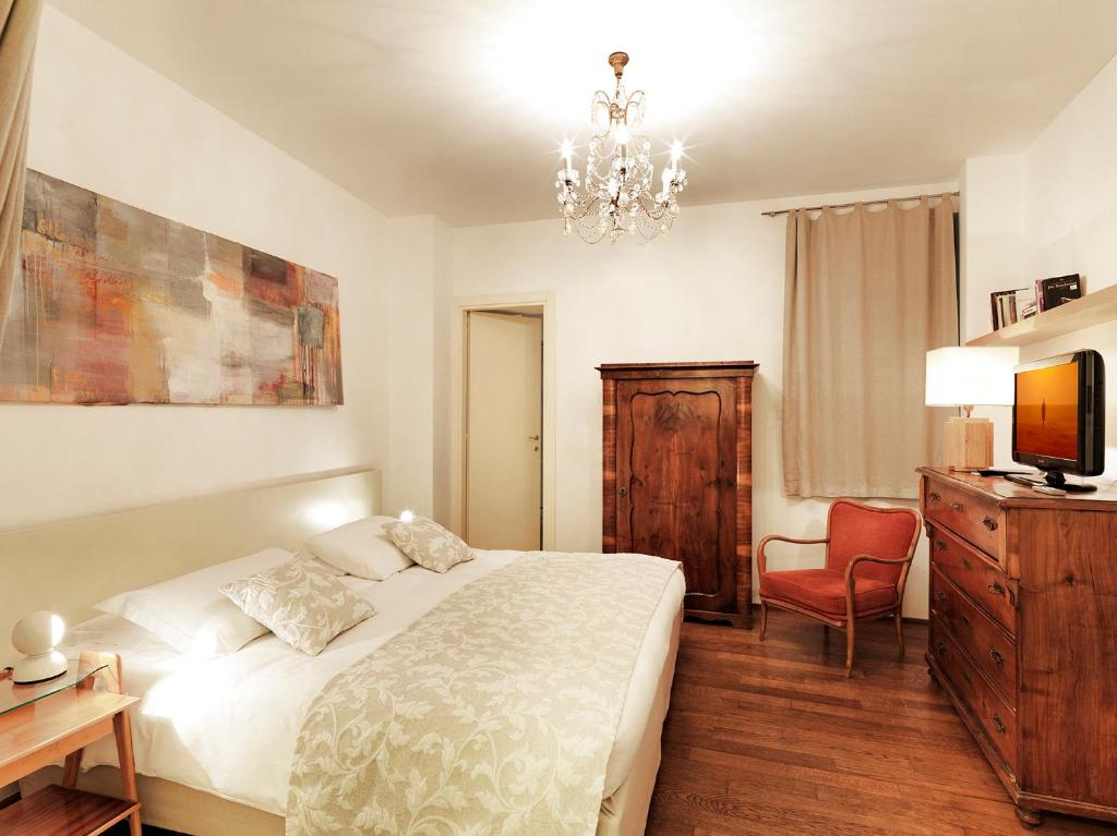 Postel nebo postele na pokoji v ubytování Boutique Hotel Albero Nascosto