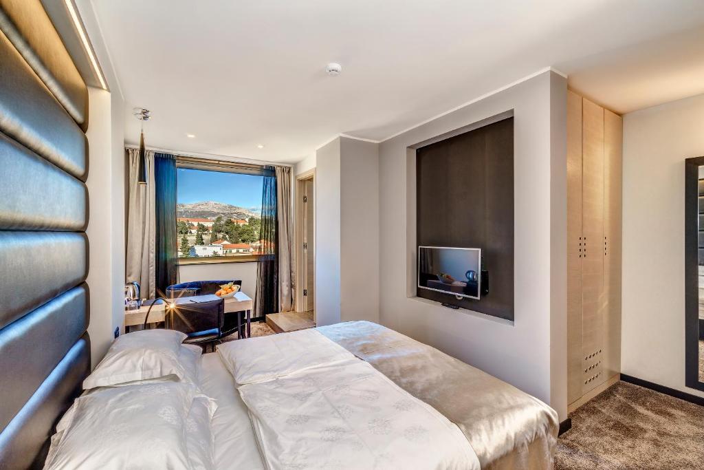 Posteľ alebo postele v izbe v ubytovaní The View Luxury Rooms