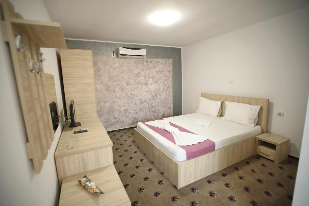 Postel nebo postele na pokoji v ubytování Vila Dorimar Mamaia Nord