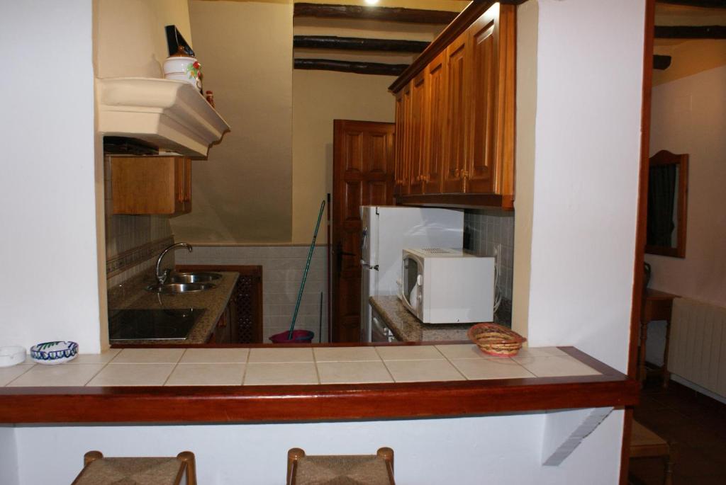 Kuchyň nebo kuchyňský kout v ubytování Casa De La Ermita