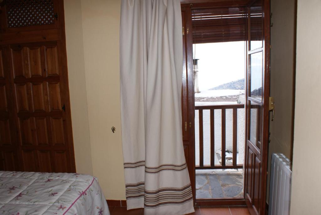 Postel nebo postele na pokoji v ubytování Casa De La Ermita