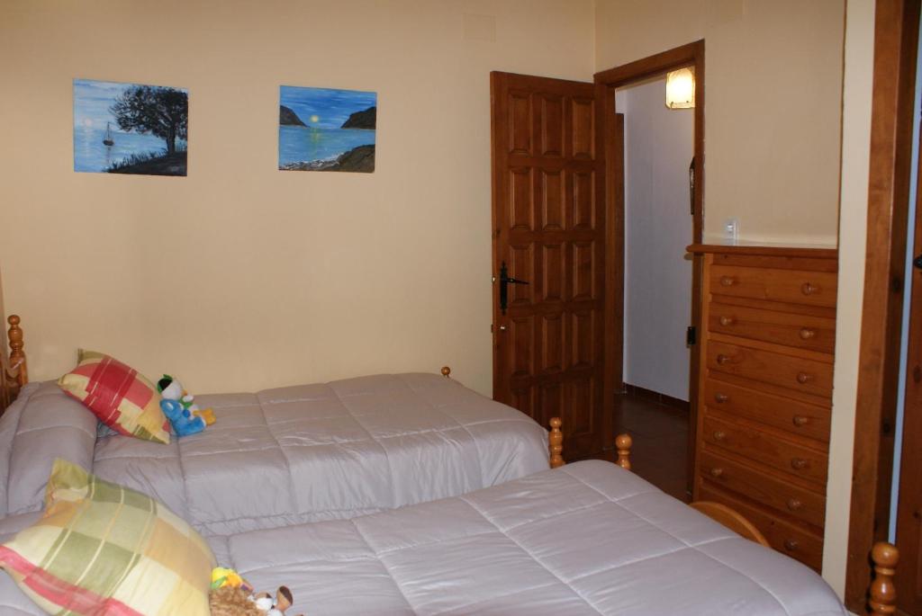Postel nebo postele na pokoji v ubytování Casa De La Ermita