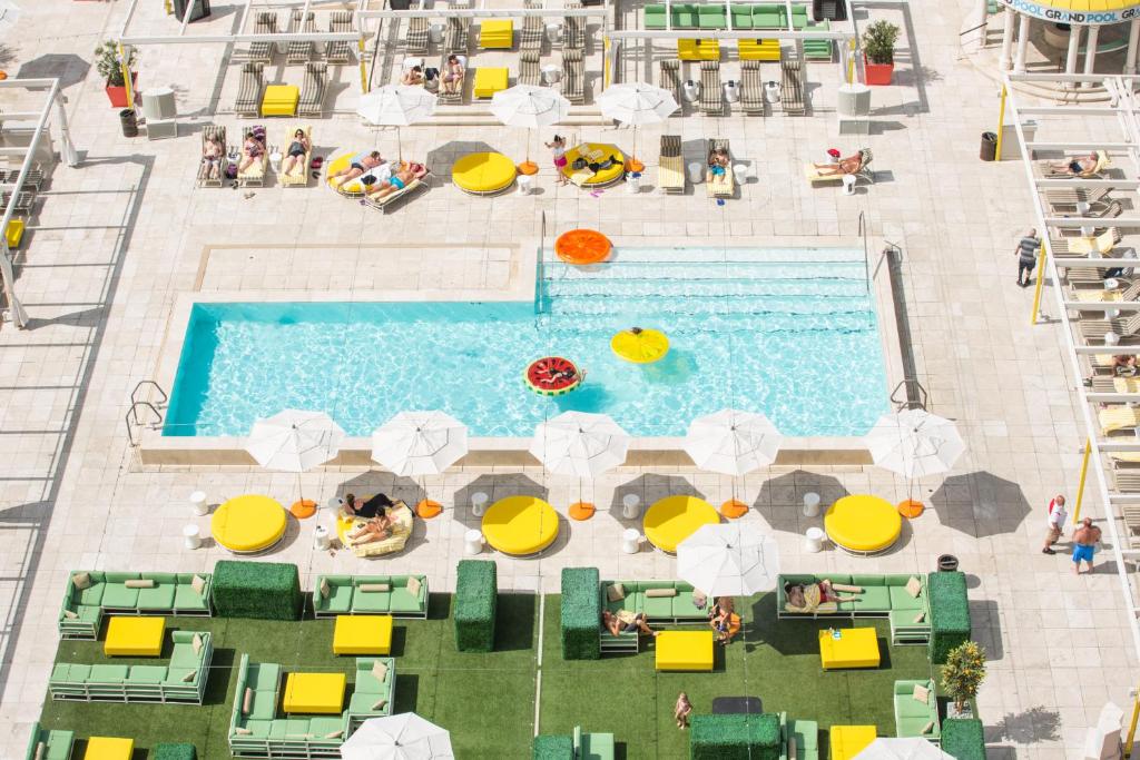 an overhead view of a swimming pool with umbrellas at Downtown Grand Hotel & Casino in Las Vegas