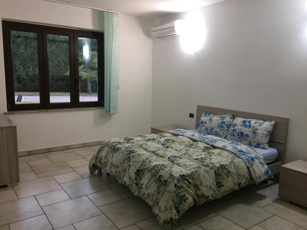 מיטה או מיטות בחדר ב-Villa Althea