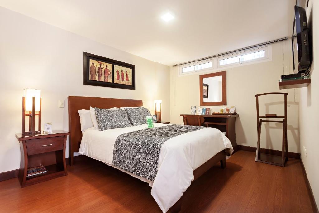 Postel nebo postele na pokoji v ubytování Loft Hotel