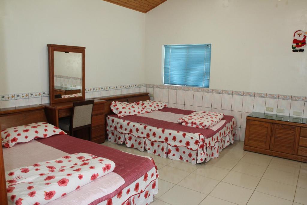 Postel nebo postele na pokoji v ubytování Fei Ying Homestay