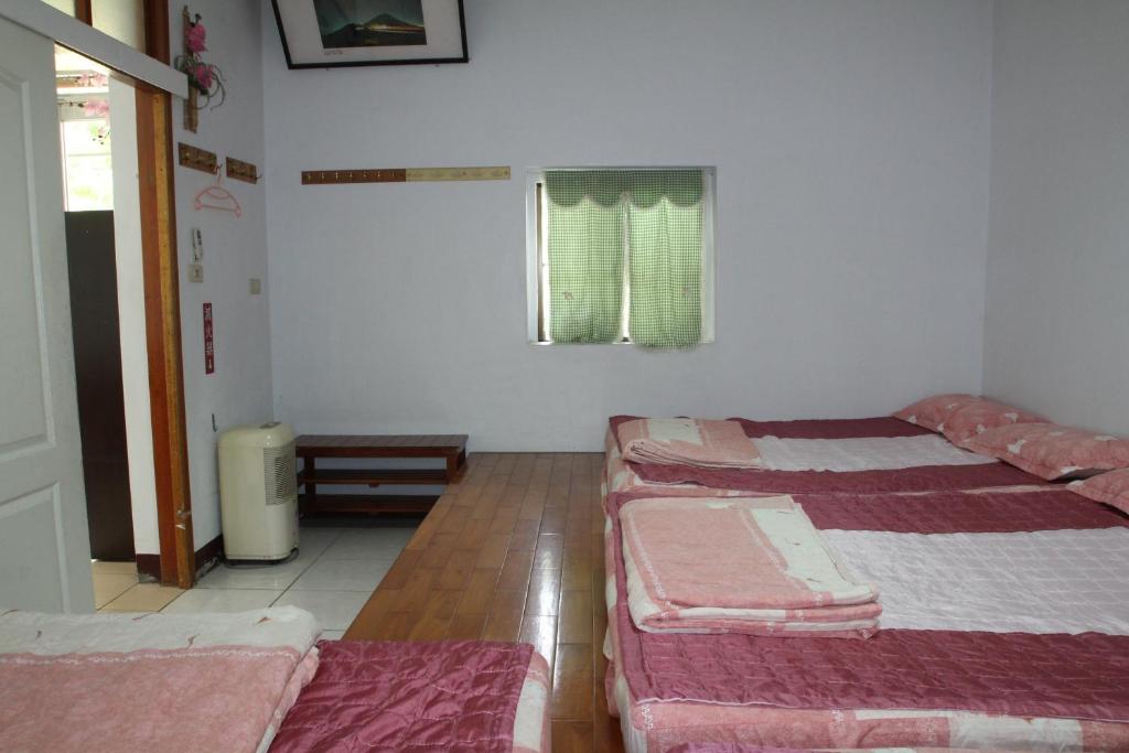 Postel nebo postele na pokoji v ubytování Fei Ying Homestay
