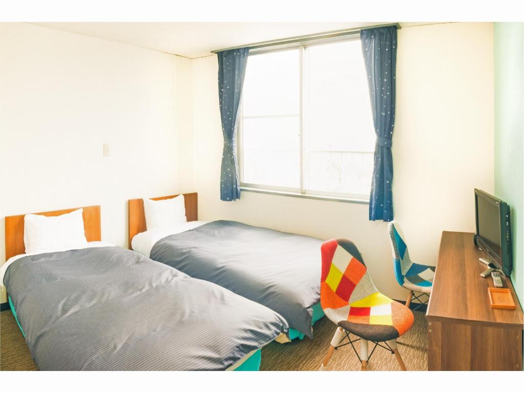 Postel nebo postele na pokoji v ubytování Hotel Ina