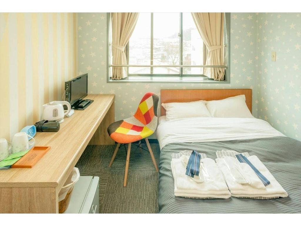 Postel nebo postele na pokoji v ubytování Hotel Ina