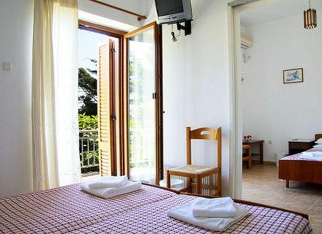 Postel nebo postele na pokoji v ubytování Artemon Hotel