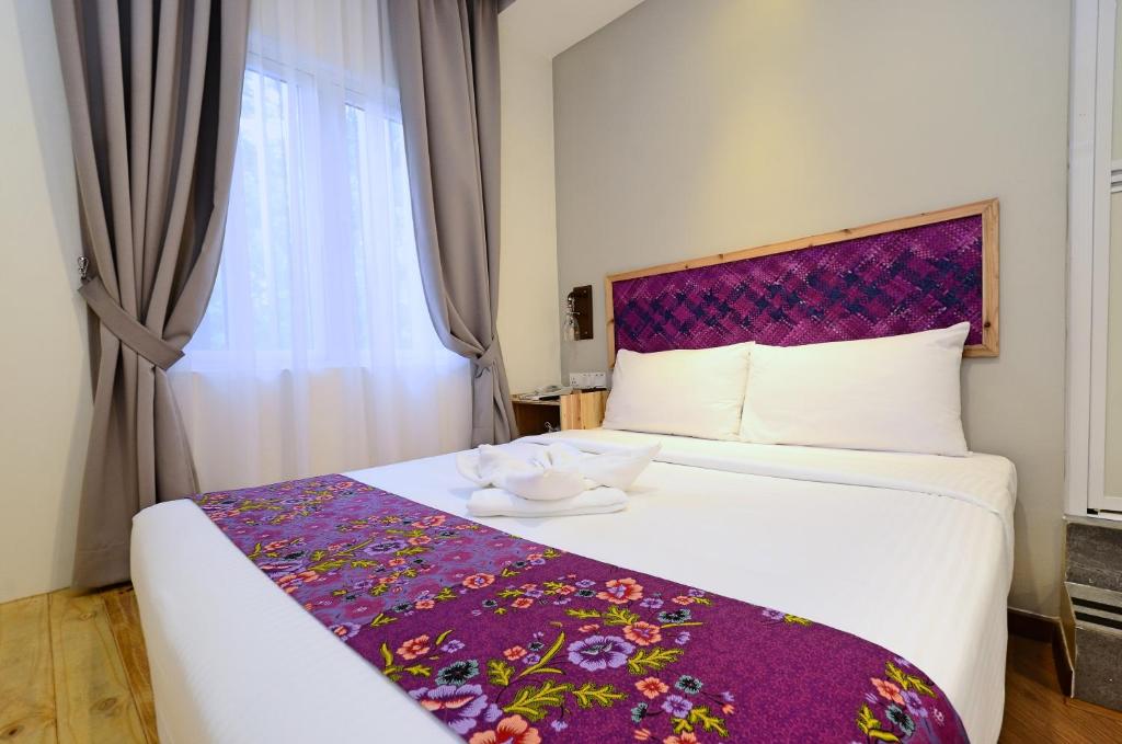 Postel nebo postele na pokoji v ubytování Artisan Eco Hotel