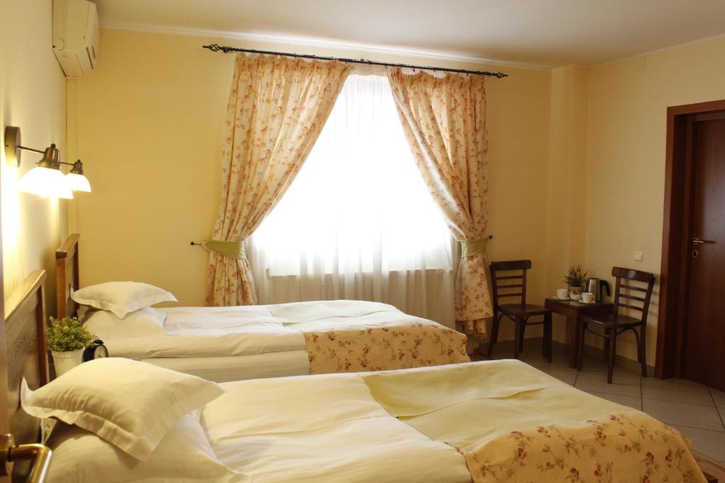 Postel nebo postele na pokoji v ubytování Vila Toparceanu - Therme & Airport Otopeni