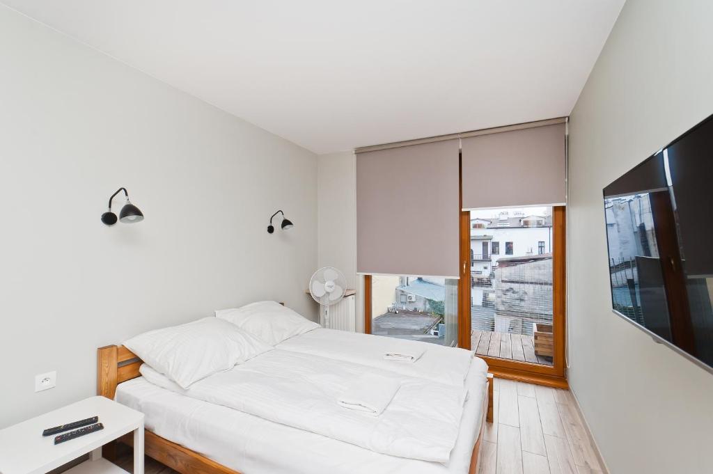 Posteľ alebo postele v izbe v ubytovaní Olimp Apartments